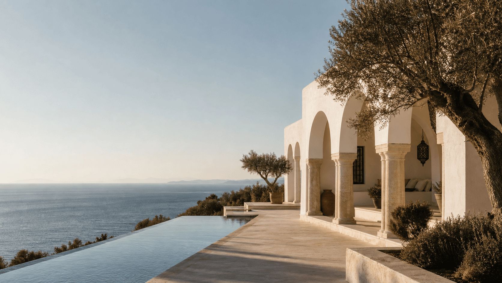 White arched Villa Azur and infinity pool overlooking the Mediterranean